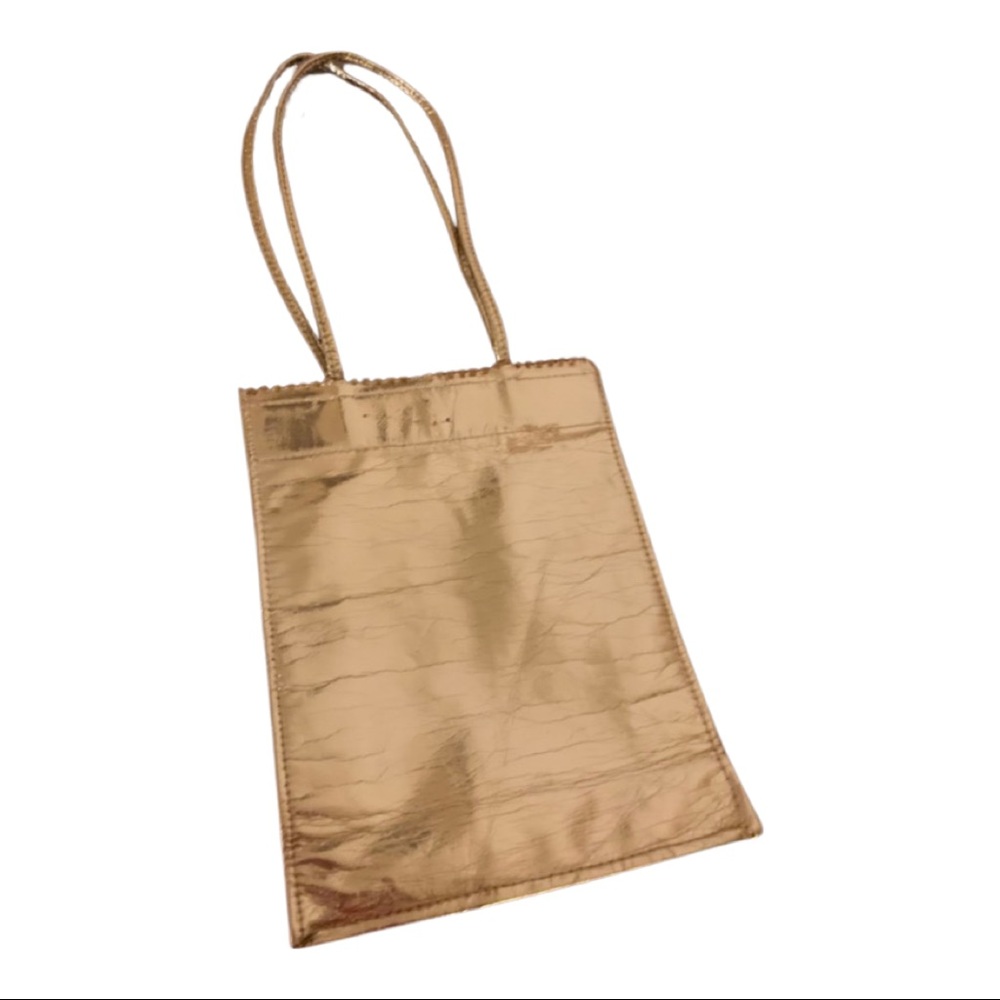 Gold purse snap closure paper bag style 9x 7 inches approximately without handle